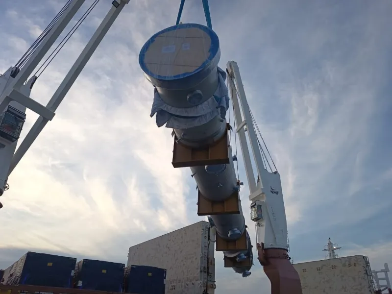 Image of crane lifting concrete pipe